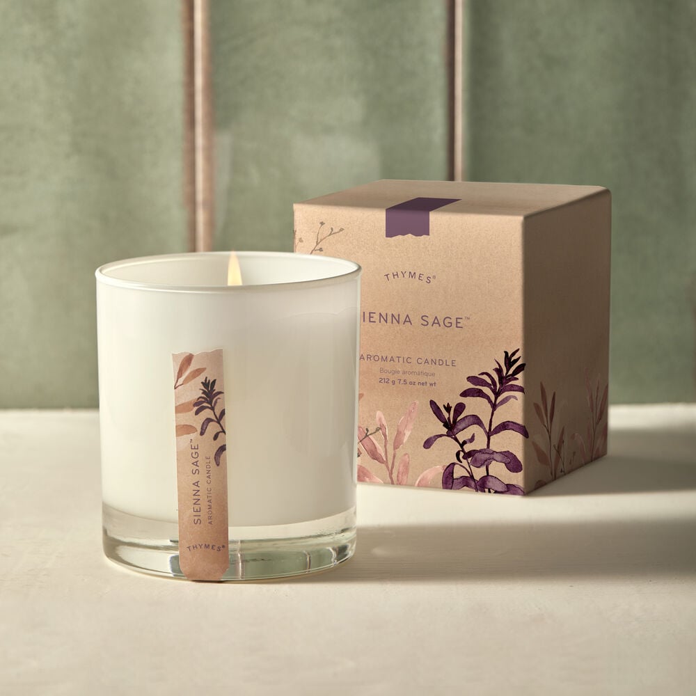 Thymes Sienna Sage Candle and Packaging on Counter image number 1
